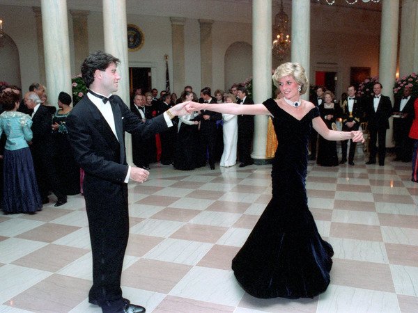 Princess Diana dances with John Travolta wearing a black dress