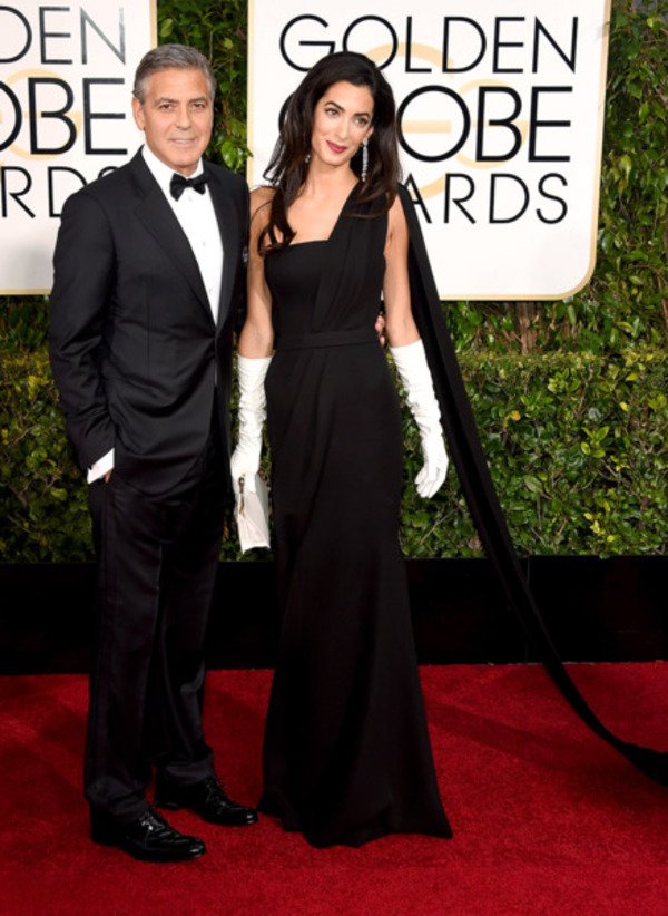 Amal Clooney with her husband George Clooney wearing black classy dress